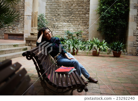 Young female is relaxing in the fresh air Young female is relaxing in the fresh air 23292240