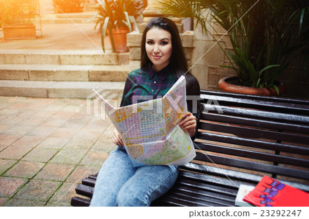 Tourist girl enjoying her vacation travel Tourist girl enjoying her vacation travel 23292247