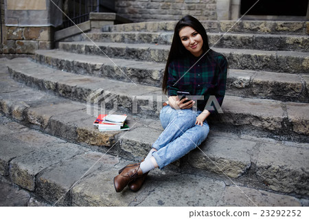Female tourist girl holding mobile phone Female tourist girl holding mobile phone 23292252