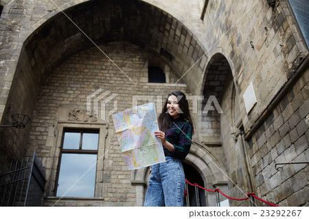 Female traveler searching right direction on city Female traveler searching right direction on city 23292267