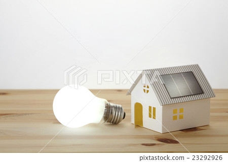 Solar house and incandescent light bulb Solar house and incandescent light bulb 23292926
