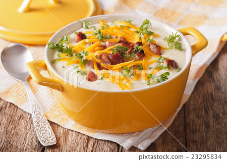 Delicious cream potato soup with bacon and cheddar 23295834