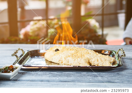 Breaded fish burns on tray. Breaded fish burns on tray. 23295973