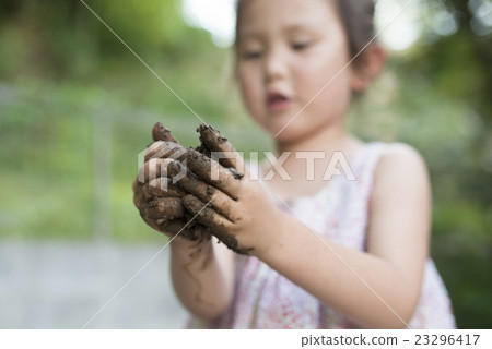A girl playing with muddy 23296417