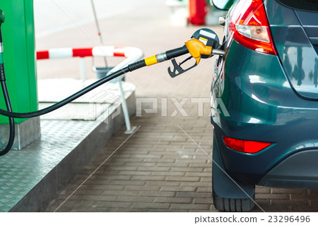 Car refueling on a petrol station Car refueling on a petrol station 23296496