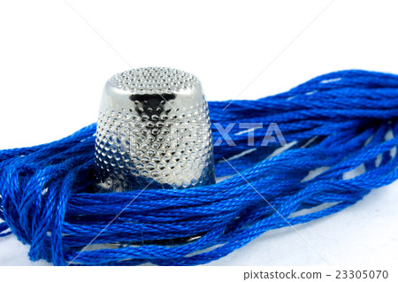 soft blue cotton thread and a thimble 23305070