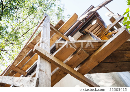 Wooden scaffolding, rural house facade Wooden scaffolding, rural house facade 23305415