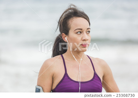 Portrait of young sports woman standing on the Portrait of young sports woman standing on the 23308730