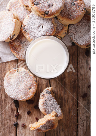 Tasty Welsh cakes with raisins and milk close-up 23308799