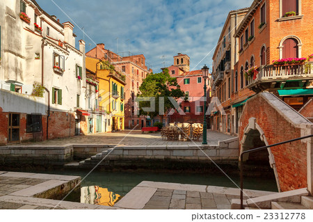 Colorful lateral canal and bridge in Venice, Italy Colorful lateral canal and bridge in Venice, Italy 23312778