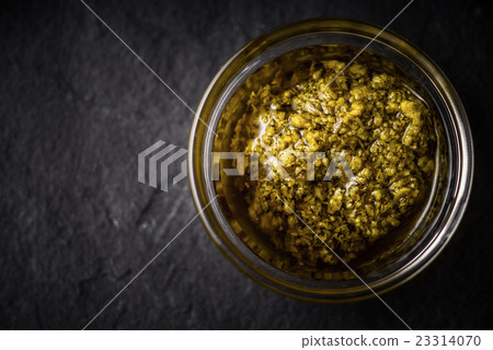 Pesto sauce in the glass jar top view Pesto sauce in the glass jar top view 23314070