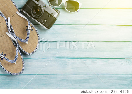 Beach accessories on wooden background 23314106