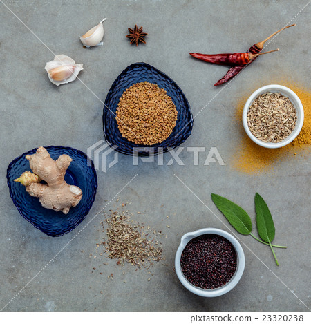 Assorted of spices set up on stone background. Assorted of spices set up on stone background. 23320238