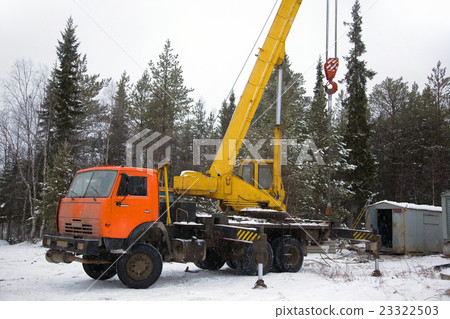 crane working in the woods in winter crane working in the woods in winter 23322503
