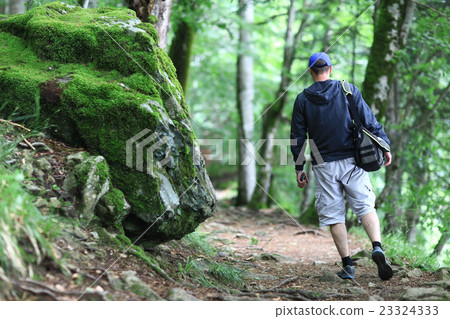 Male tourist in a spring forest 23324333
