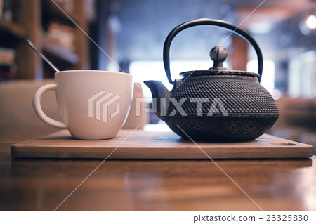 teapot and cup of tea at a cafe 23325830