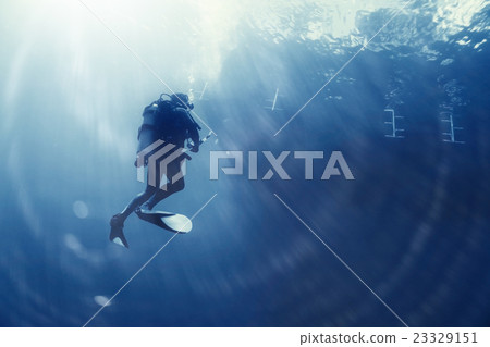 unusual photo diver underwater background 23329151