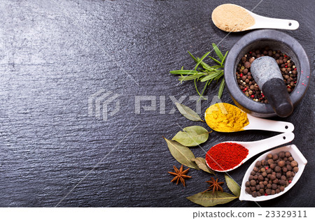 various spices on dark background various spices on dark background 23329311