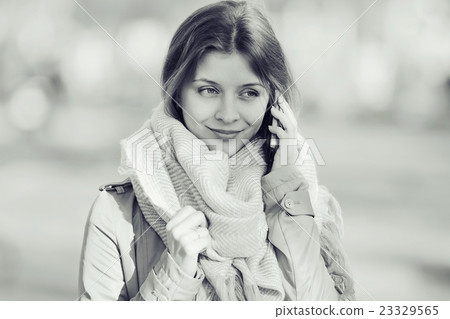 monochrome urban portrait of a woman in a coat 23329565