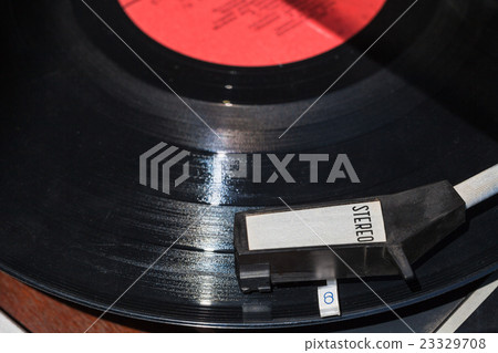 above view of vinyl disc in record player above view of vinyl disc in record player 23329708