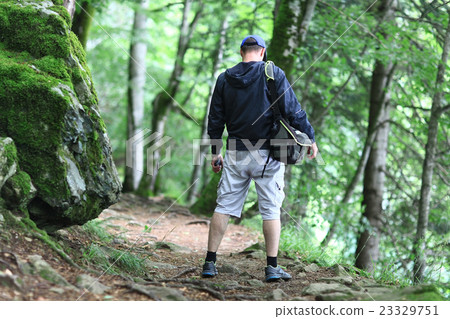 Male tourist in a spring forest 23329751