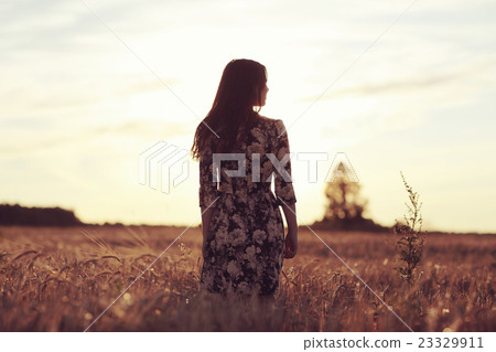 woman field Italian style sunset woman field Italian style sunset 23329911
