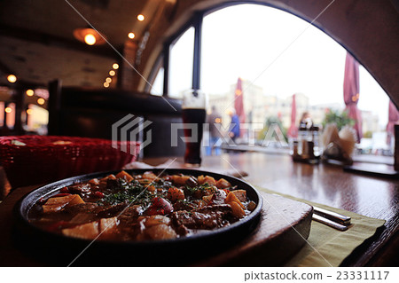 Served hot in a pan in a restaurant Served hot in a pan in a restaurant 23331117