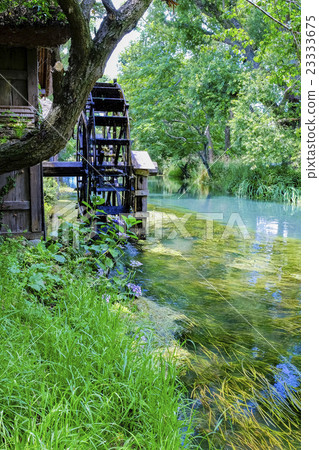 Water mill and clear stream (vertical) 23333675