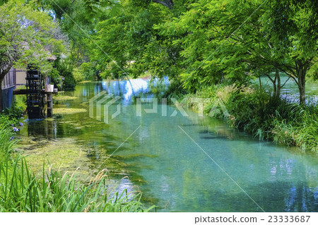 Water mill and clear stream 23333687