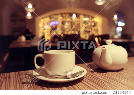 teapot and cup of tea at a cafe 23334144