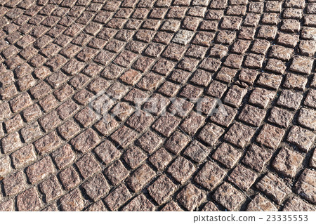 Brown cobblestone street pavement, texture 23335553