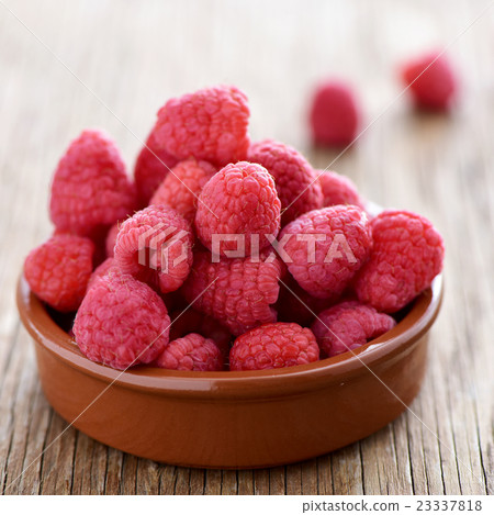 raspberries on a wooden table raspberries on a wooden table 23337818