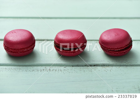 red macarons on a blue rustic surface red macarons on a blue rustic surface 23337819