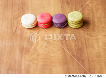 Colorful French Macarons on wooden background. 23341686