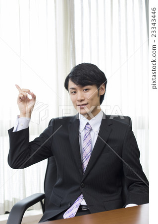 Male businessman's finger pointing 23343446