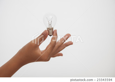 Light bulb held in hand 23343594
