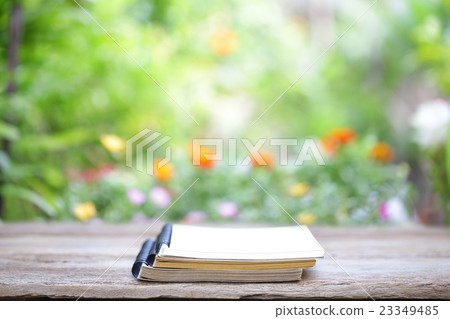 Notebook on wooden table 23349485