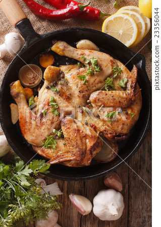 Chicken tobacco with vegetables close-up 23356044