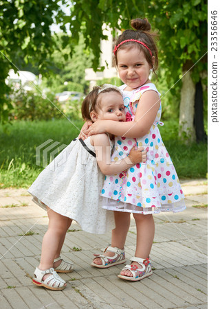 happy child portrait, two girl love and embrace 23356646