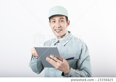 Working clothes men who operate tablets Working clothes men who operate tablets 23356825