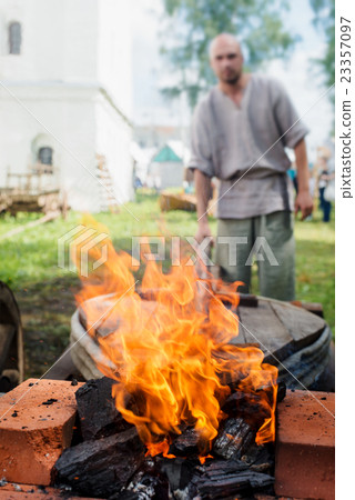 coals to heat the iron 23357097