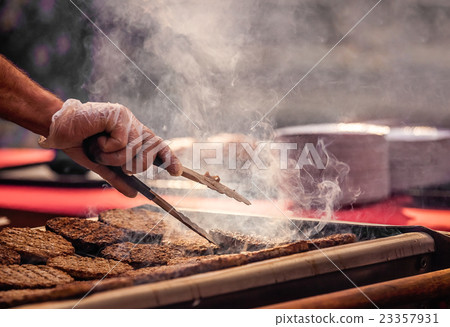 Burgers on barbecue 23357931