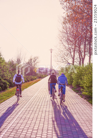 People riding bicycle in Jurmalas Park, Ventspils People riding bicycle in Jurmalas Park, Ventspils 23359024
