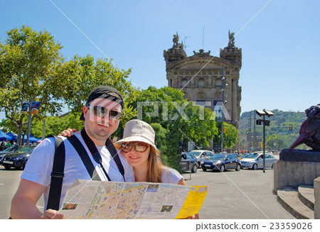 Tourists with a city map in La Rambla Street Tourists with a city map in La Rambla Street 23359026