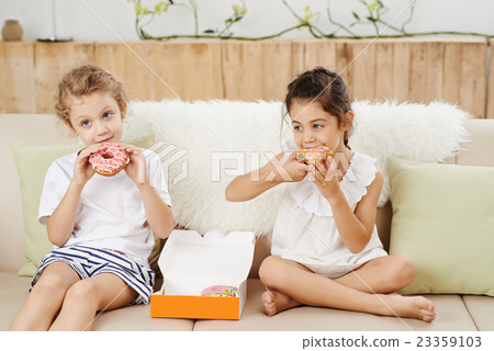 Enjoying doughnuts Enjoying doughnuts 23359103