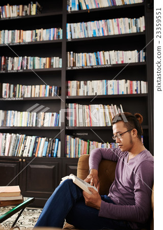 Reading a book 23359551