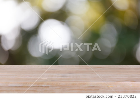 Wood table top on bokeh green background Wood table top on bokeh green background 23370822