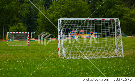 view of a net on vacant soccer pitch. view of a net on vacant soccer pitch. 23371570