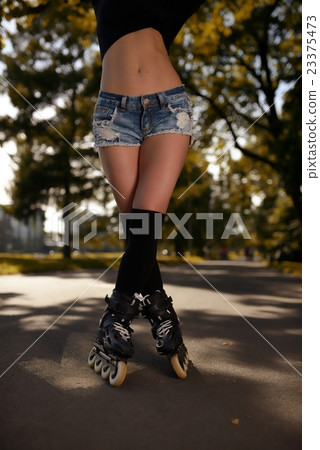 Sexy female legs in roller skates 23375473