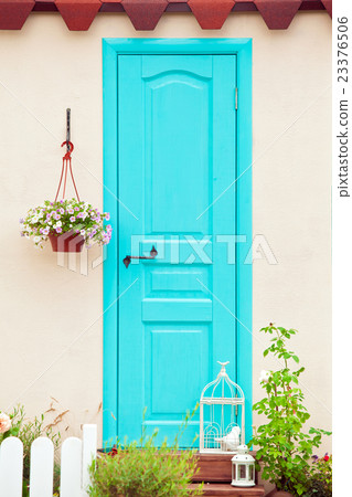 Aqua color door entrance to the house Aqua color door entrance to the house 23376506